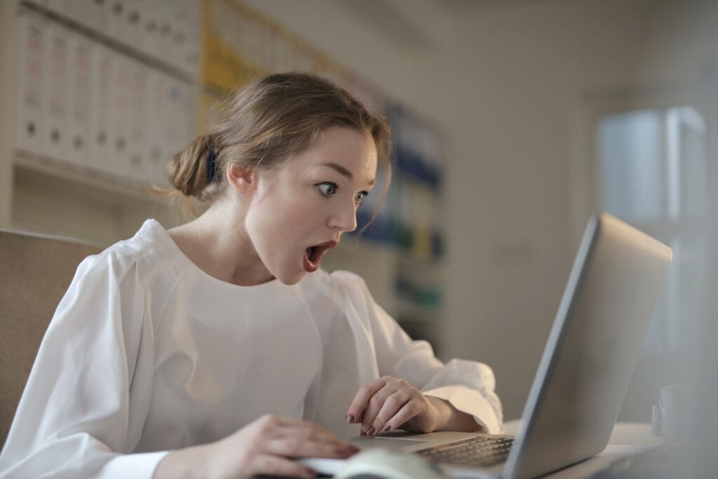 excited teen read college admissions decision